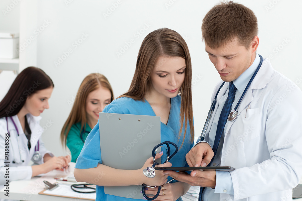 Male medicine doctor consulring his colleague Male medicine doctor consulring his colleague