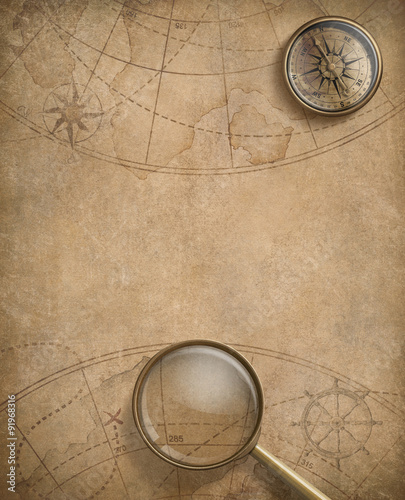 old nautical map with compass and loupe