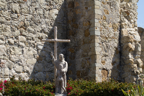 Statue honoring Junipero Serra in Mission San Juan Capistrano in southern California photo