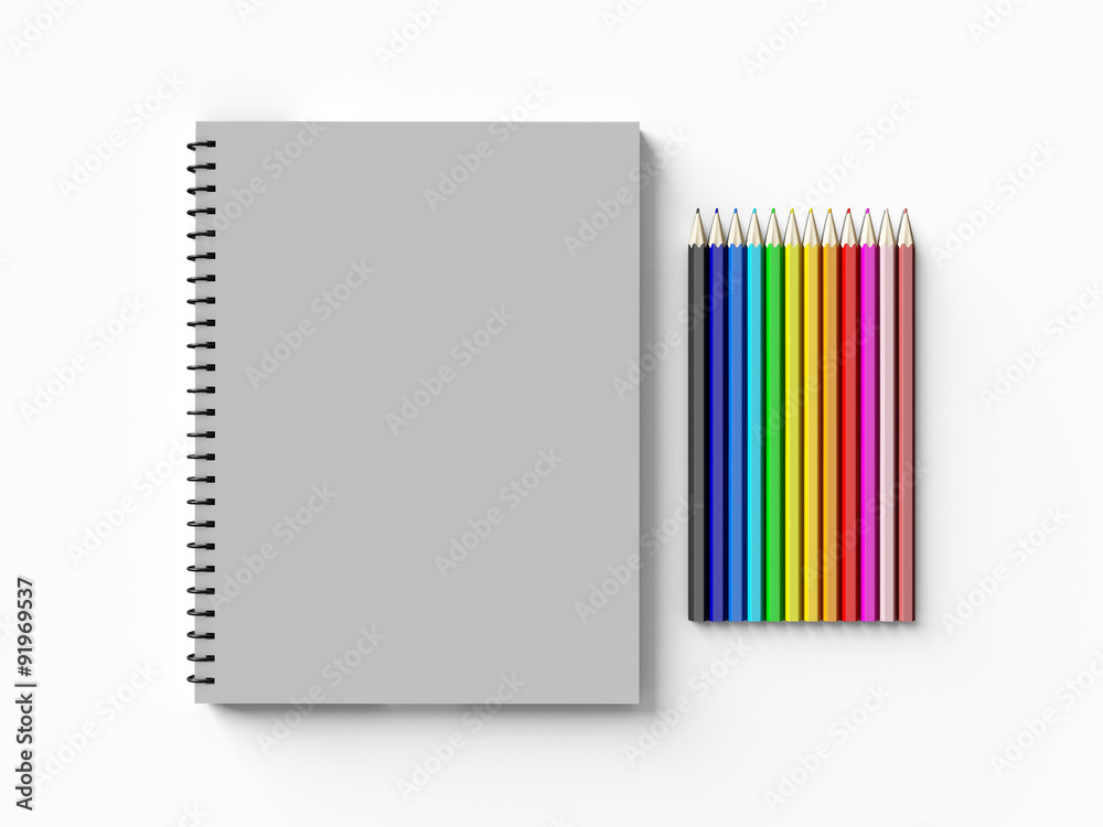 notebook with colored pencils on White background notebook with colored pencils on White background
