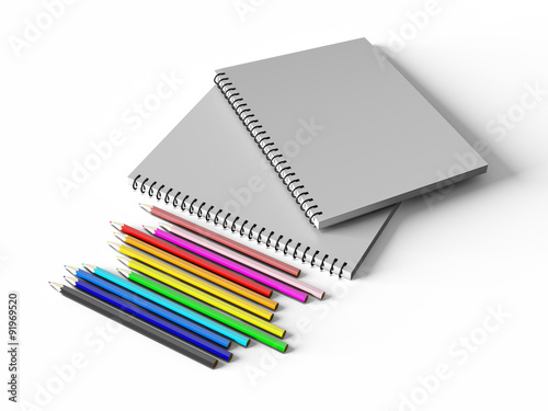 notebook with colored pencils on White background