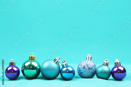 Blue Christmas tree ornaments on blue background