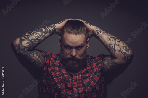 Fotografie, Tablou Brutal guy with beard and tattooes.