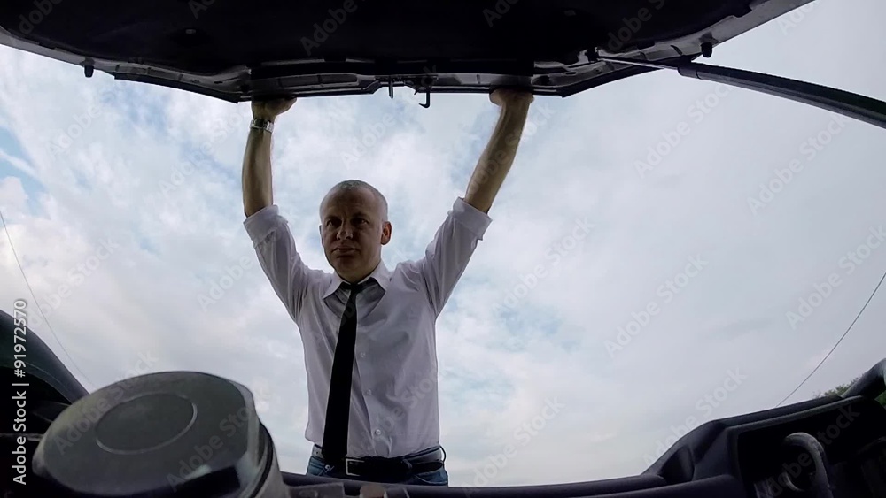 Driver frustration on the road, businessman with car engine failure speaking with cell phone, business man calling tow truck for emergency with mobile telephone, people and transportation problems