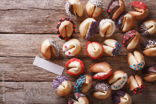 Beautiful fortune cookies decorated with candy sprinkles. Horizontal top view
