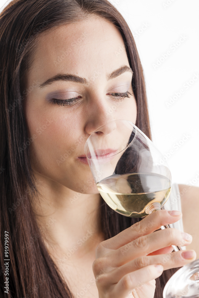 portrait of young woman tasting white wine portrait of young woman tasting white wine