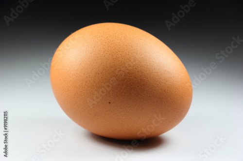 Single chicken egg isolated on background