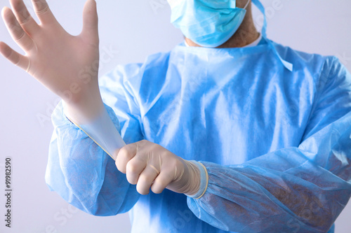 Man surgeon holds a scalpel in an operating room