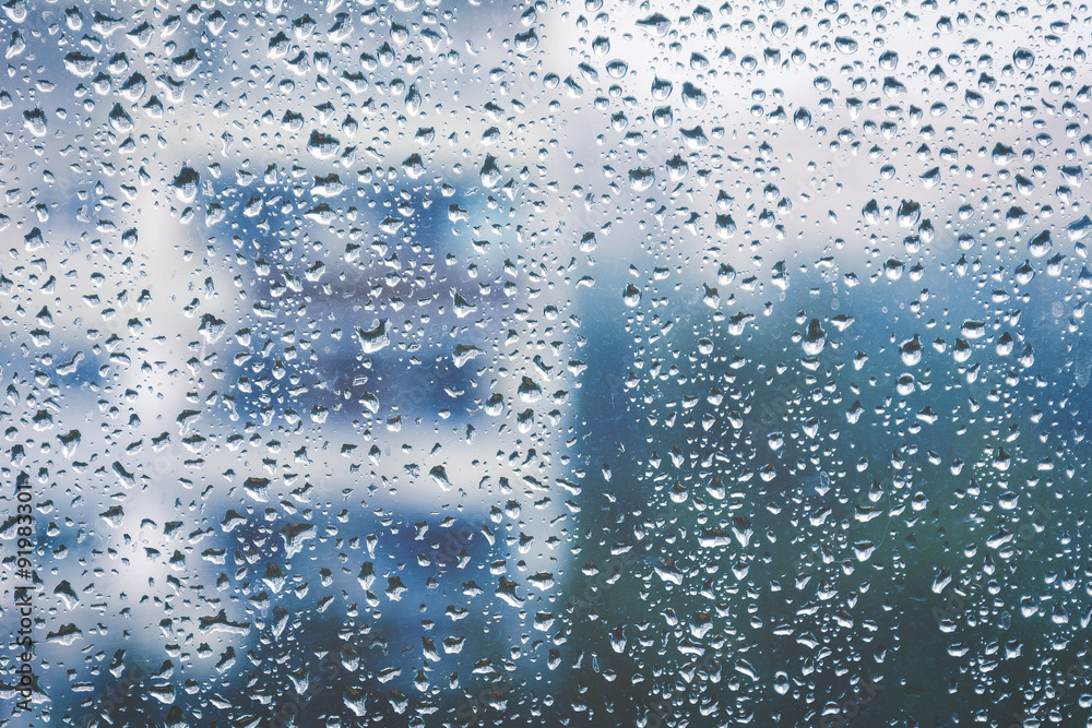 Rainy window, blurry view. Cold tones Rainy window, blurry view. Cold tones