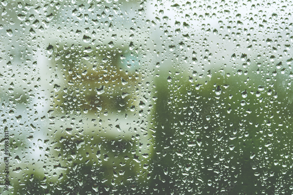 Rainy window, blurry view. Warm tones Rainy window, blurry view. Warm tones