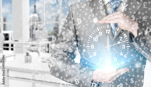 Image of businessman holding clock against illustration