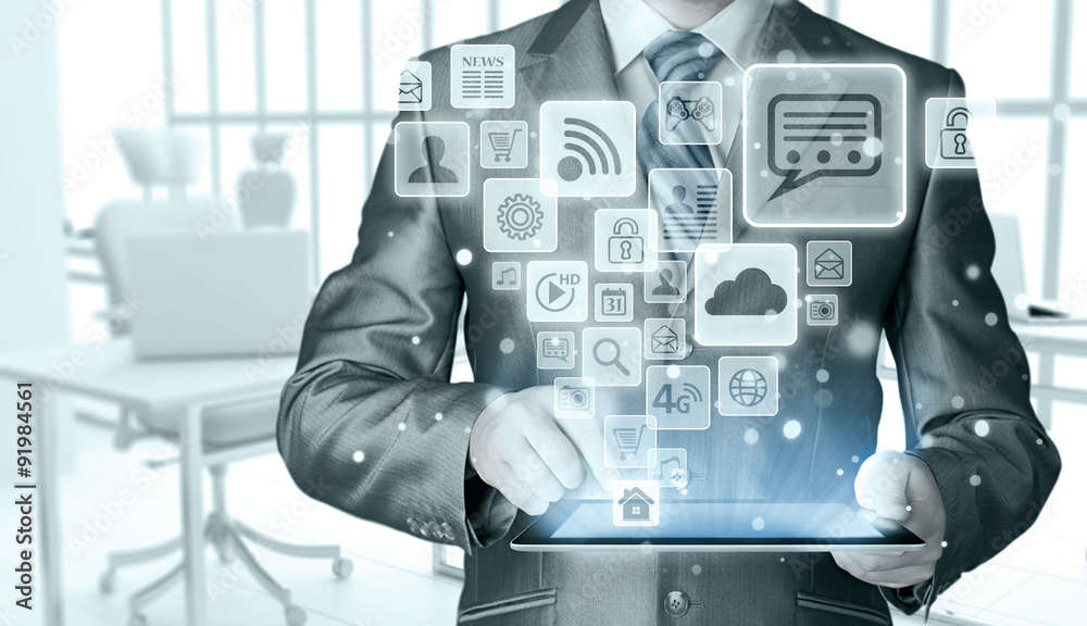 Business man using tablet PC with social media icon set Business man using tablet PC with social media icon set