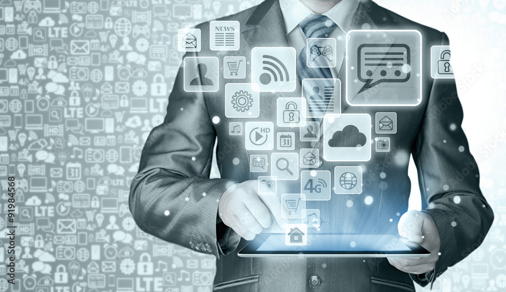 Business man using tablet PC with social media icon set Business man using tablet PC with social media icon set