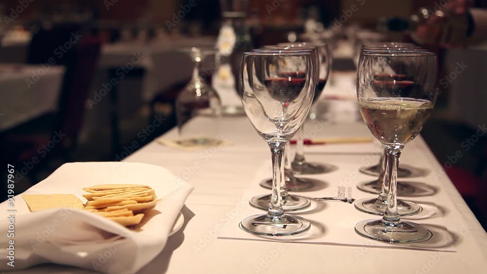 Pouring Wine into Glasses for Tasting Pouring Wine into Glasses for Tasting