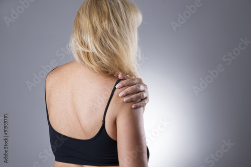 Woman with pain in shoulder. Pain in the human body