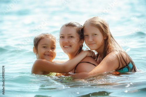 Happy family playing on sea © Andriy Petrenko