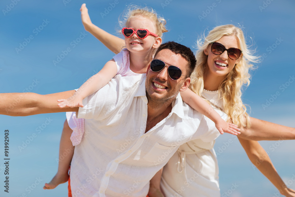 happy family having fun over blue sky background happy family having fun over blue sky background