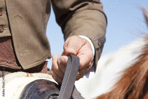 Tableau sur toile Vaquero montando a caballo