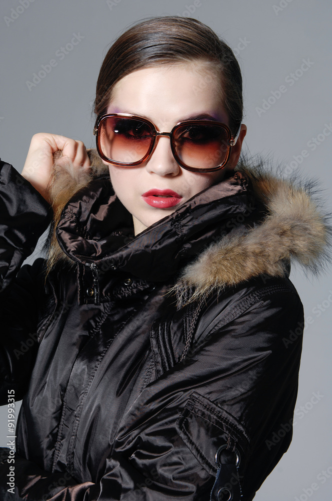 Closeup portrait of gorgeous young lady in sunglasses
