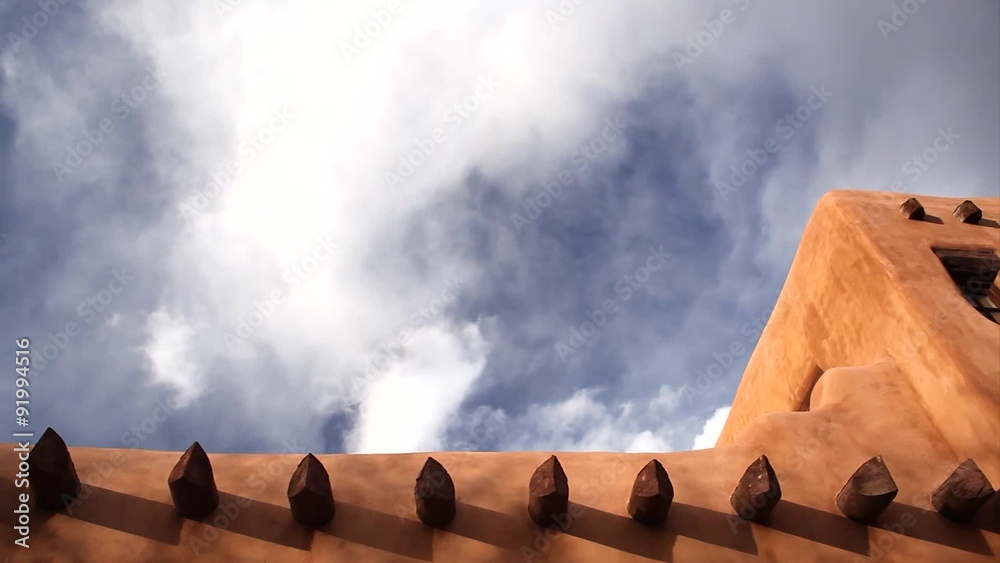 Clouds and Roof Line of Adobe Building