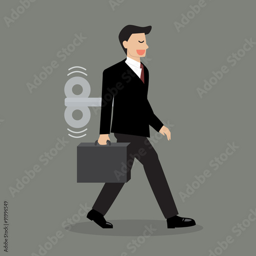 Businessman with wind-up key in his back