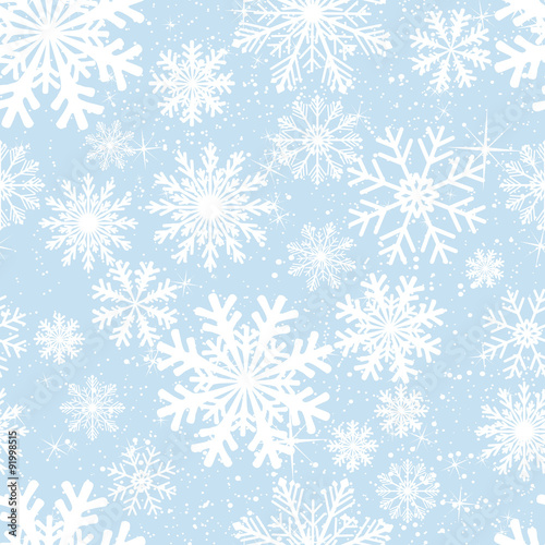 Seamless winter background with snowflakes. Colorful Christmas pattern.