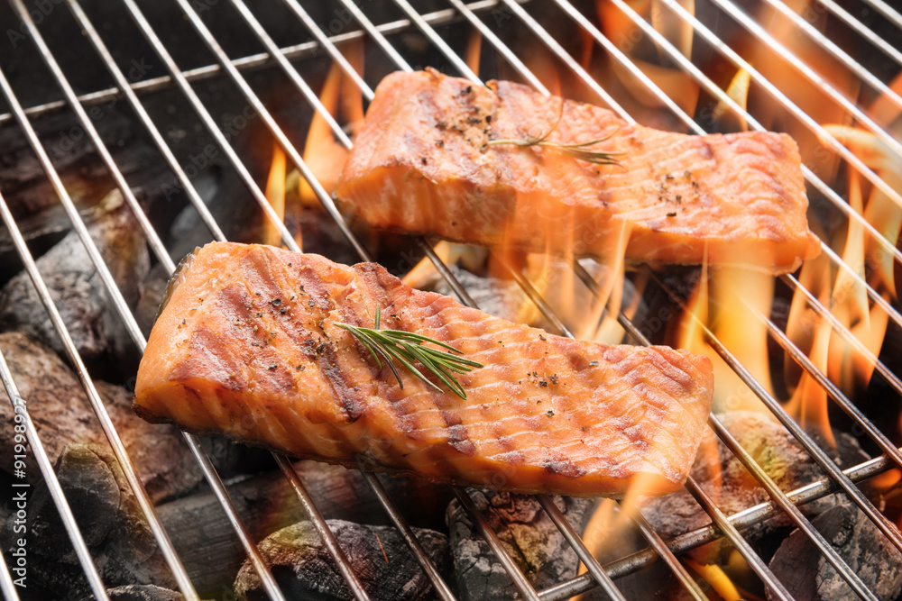 Grilled salmon steaks on the flaming Grilled salmon steaks on the flaming