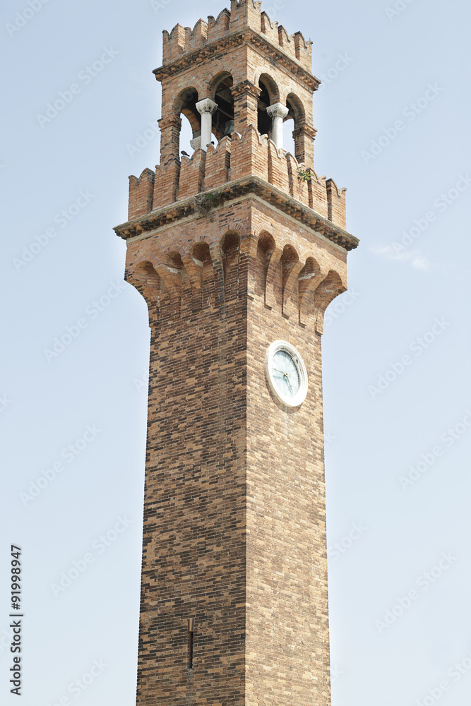 Brick bell tower of San Giacomo at San Stefano square, located at Murano Island, Italy