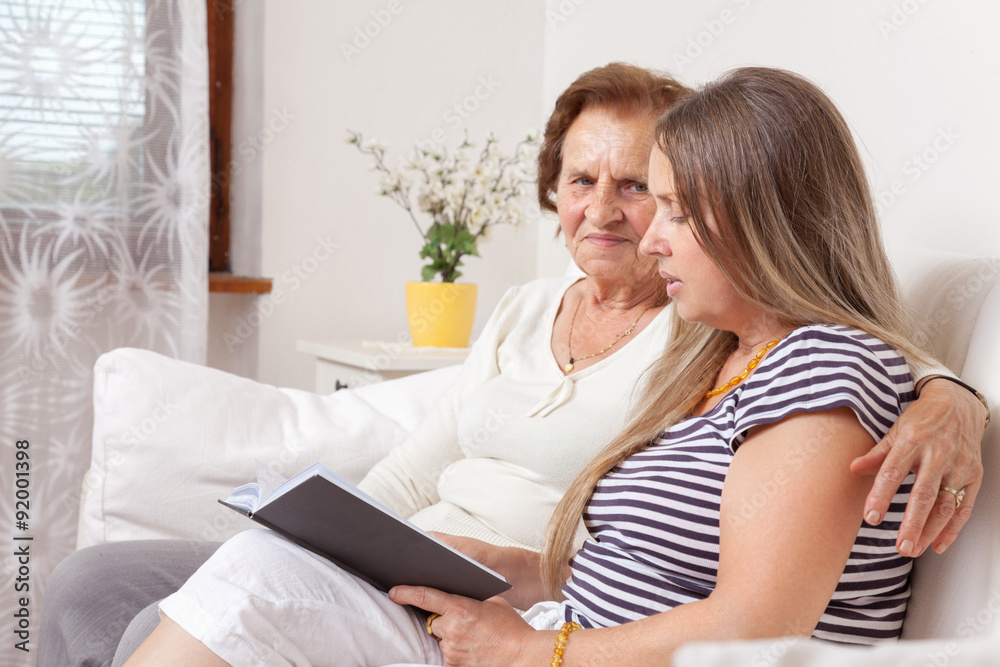 Carer spending time with an elderly woman Carer spending time with an elderly woman