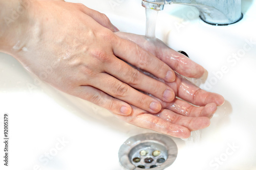 Washing of hands with soap under running water12