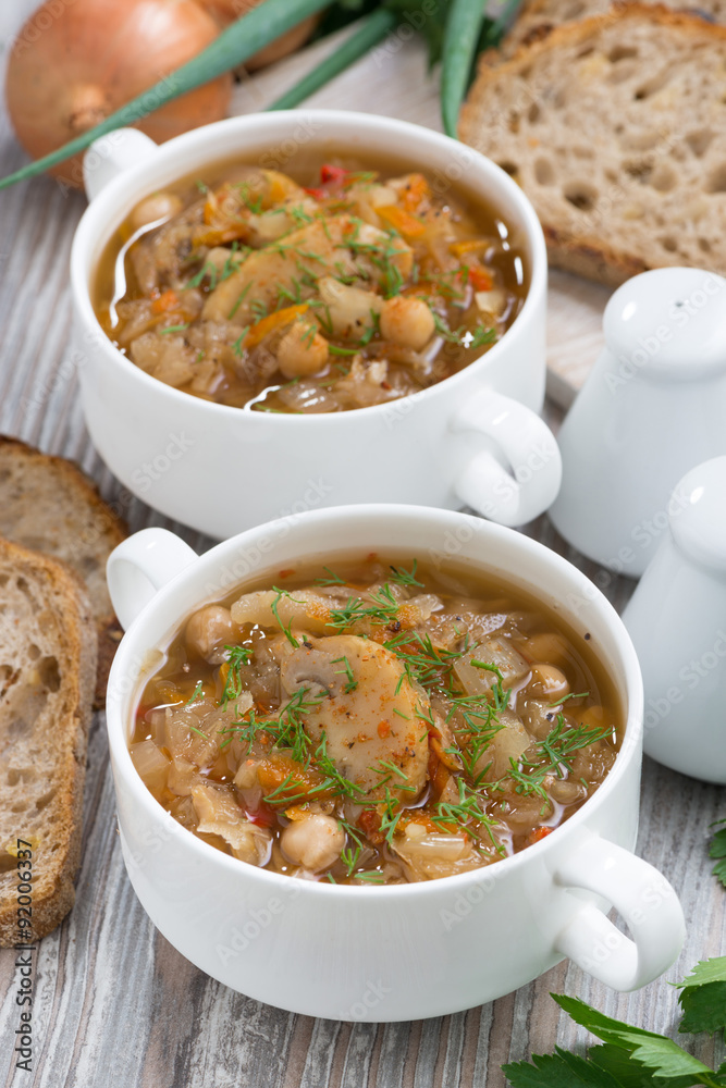soup with cabbage, mushrooms and chickpeas, vertical, top view soup with cabbage, mushrooms and chickpeas, vertical, top view