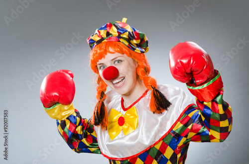 Clown with boxing gloves isolated on white © Elnur