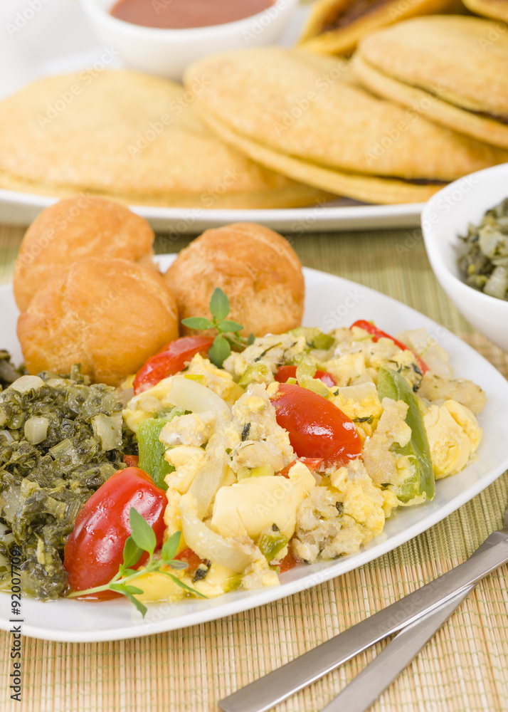 Ackee & Saltfish - Traditional Jamaican dish made of salt cod and ackee fruit. Served with callaloo and johnny cakes.
Ackee & Saltfish - Traditional Jamaican dish made of salt cod and ackee fruit. Served with callaloo and johnny cakes.