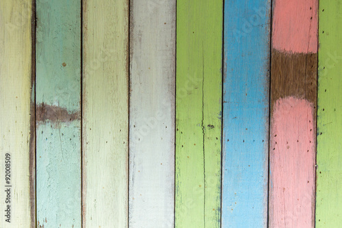 Old painted colorful wooden wall.