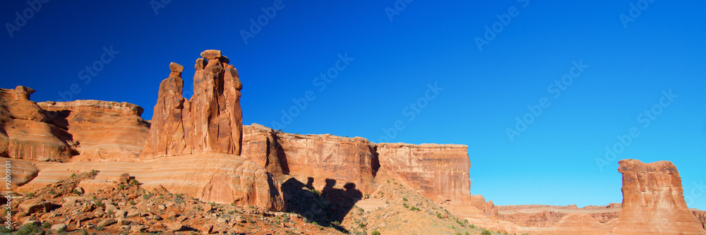Panorama with shadow of The Three Gossips rock formation in Arches National Park near Moab, Utah
