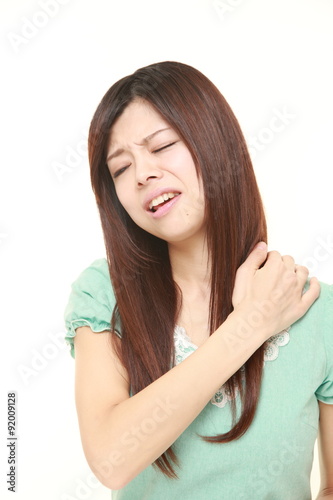 young Japanese woman suffers from neck ache © jedi-master