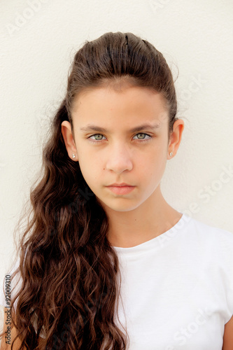 Angry preteen girl with blue eyes