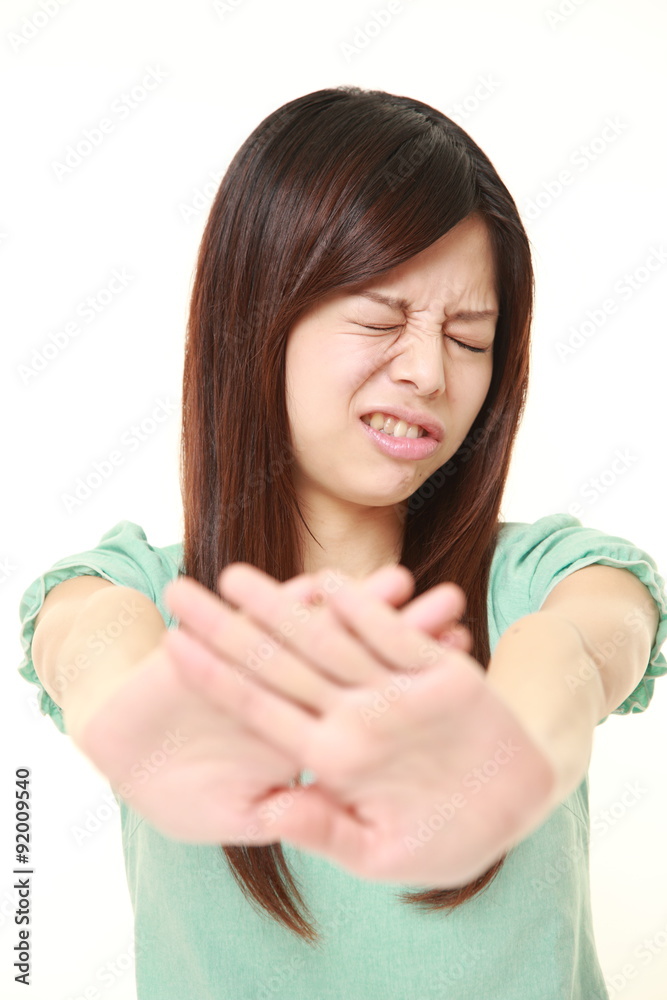 young Japanese woman making stop gesture young Japanese woman making stop gesture