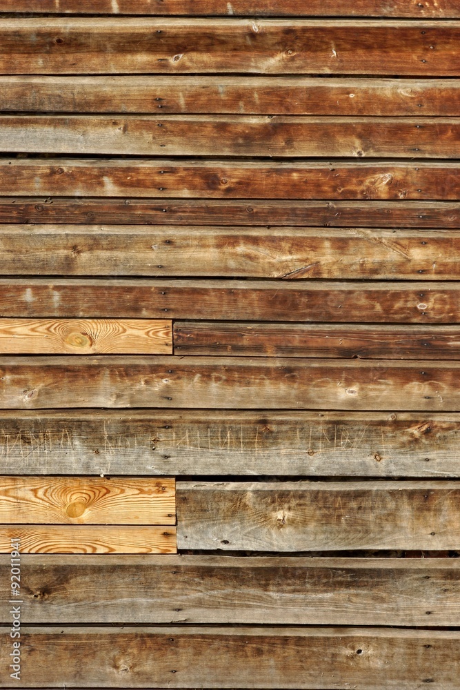 Obraz premium Weathered Old Natural Wood Siding Panel With Hanwritten Vandal S