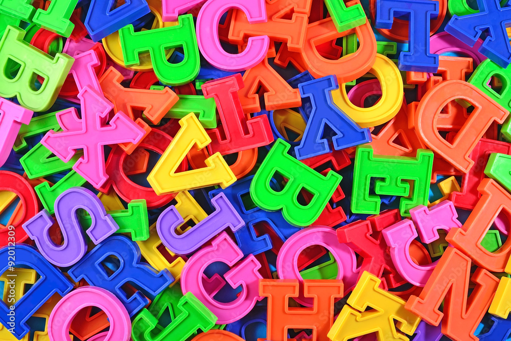 Colorful plastic alphabet letters as background Colorful plastic alphabet letters as background