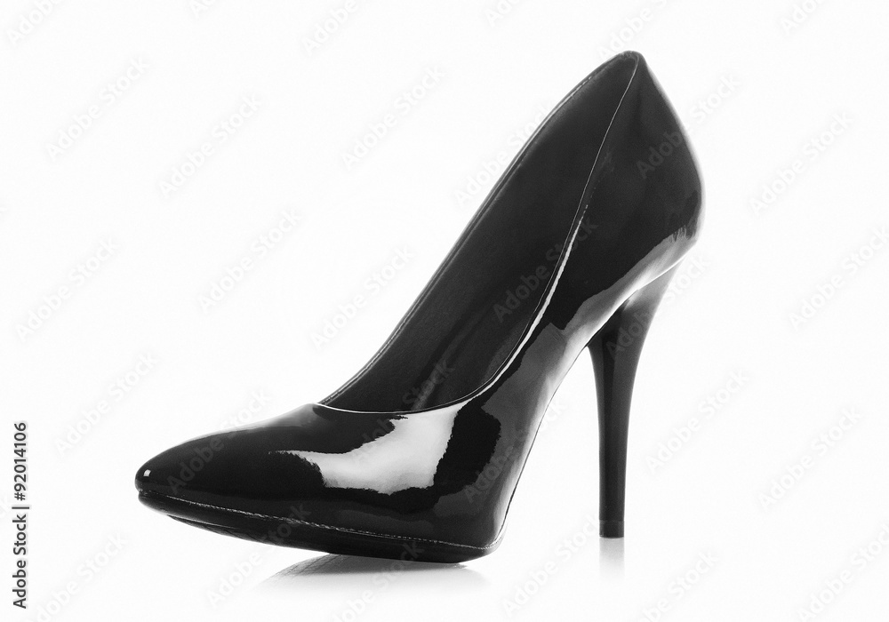 A black heel shoe isolated on white background. With Clipping path. A black heel shoe isolated on white background. With Clipping path.