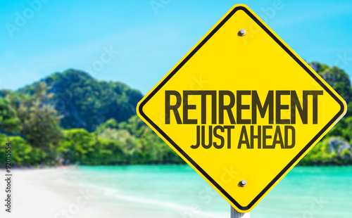 Retirement Just Ahead sign with beach background