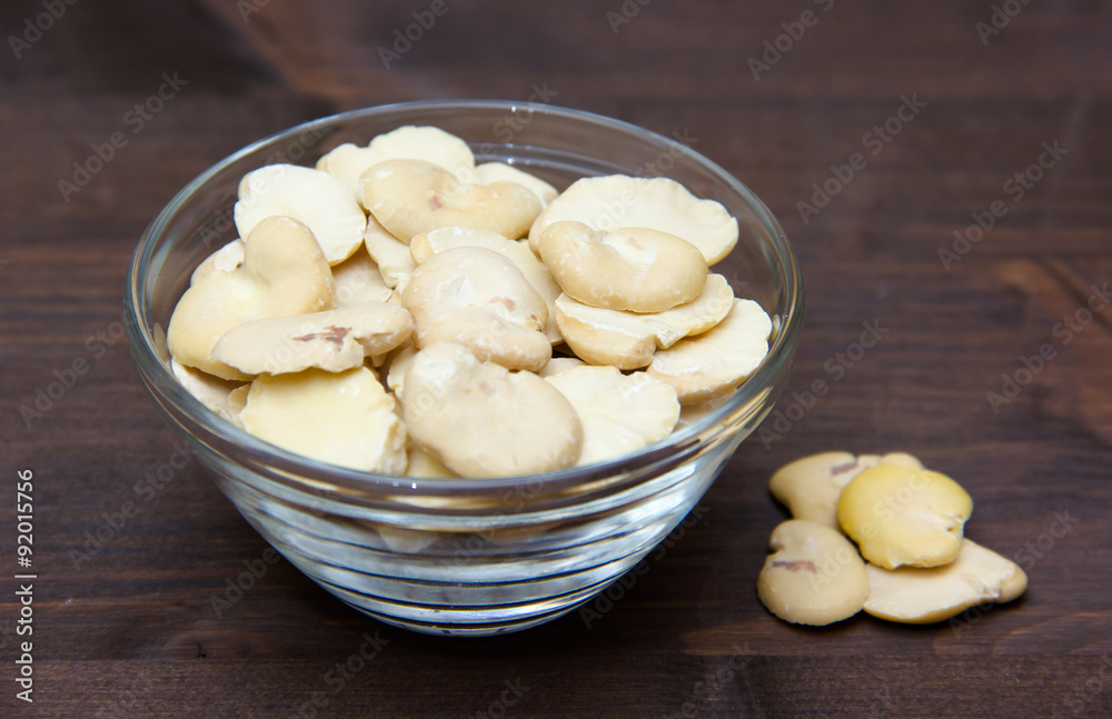 Dried beans in bowl on wooden table