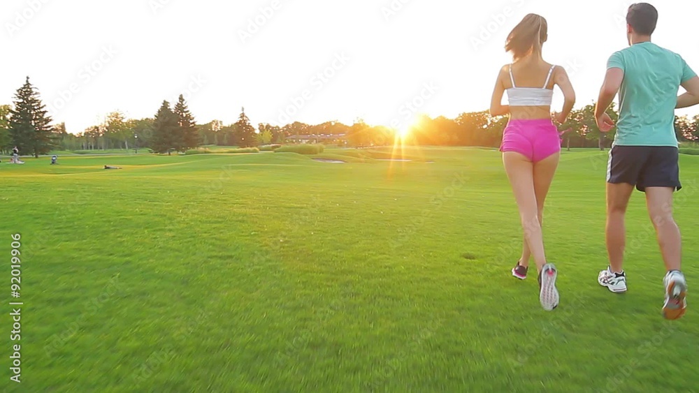 Guy and a girl running in the park. Guy and a girl running in the park.