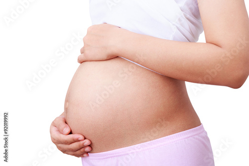 pregnant woman caressing her belly isolated on white background - Asian people.Clipping path © kamolrat