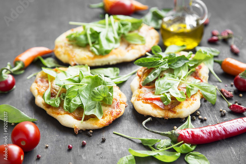 Mini Pizzas with Mozzarella,Spinach and Fresh Basil