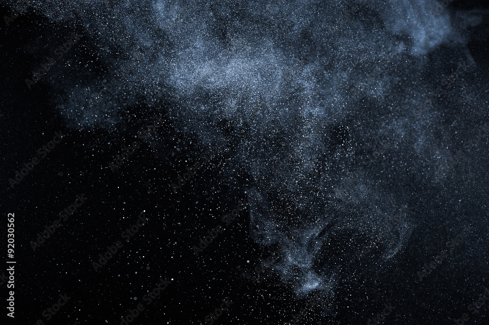 abstract white dust explosion  on black background. abstract white powder explosion  on black background. abstract texture.