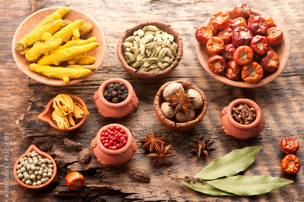 Spices and spicy on a wooden background. Top view, horizontal