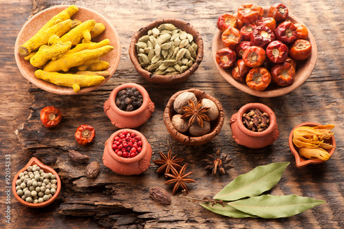 Spices and spicy on a wooden background. Top view, horizontal