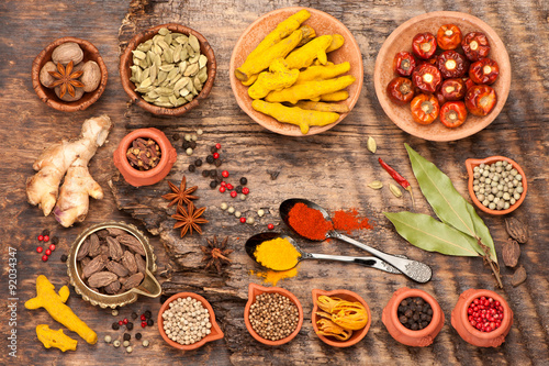 Various spices and spicy on a wooden background. Top view, horizontal
